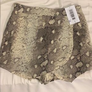 Snake print envelope skirt, shorts in the back
